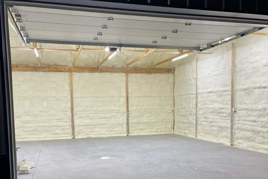 Completed garage spray foam insulation project in Fort Worth with visible foam coverage on all walls.